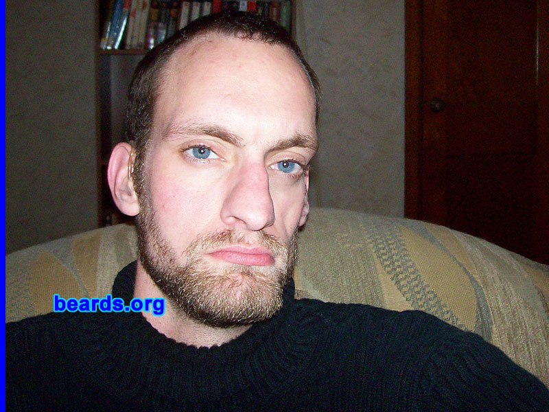 Josh
Bearded since: 2009.  I am an experimental beard grower.

Comments:
I grew my beard because I felt I owed it to myself to try it at least once. Besides, I have a thin face and thought a change might be nice. And razors are too expensive now; I'd rather shave just my neck and be done with it!

How do I feel about my beard? Well, I've been getting lots of compliments for the last week or so. I stopped shaving about a month ago. I notice my cheeks aren't filling out as much as I had hoped. Then again, my beard comes in blond, very blond, and brown, so it might look patchy for a while yet. I like it, though. My cat thinks it's great.  She has another scratchy thing to rub her head against.
Keywords: full_beard