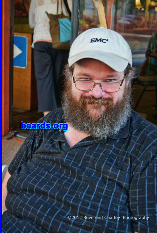 Lee B.
Bearded since: 1982. I am a dedicated, permanent beard grower.

Comments:
I grew my beard because I first liked how it look on other adults. Growing a beard helped me redefine who I was and set me apart from others in both my family and my circle of friends.

How do I feel about my beard? Now that I have a long (and somewhat gray) beard, it's like an appendage. I wouldn't know what to do without it. It may seem strange to others but I really don't know and cannot imagine how I would look without it. I have had many styles over the years including the (ugh) chin strap. This is the one that I like. It is unique and it fits my personality at this time. I'll have to shave someday but not today.

"He that hath a beard is more than a youth, and he that hath no beard is less than a man." -William Shakespeare-
Keywords: full_beard