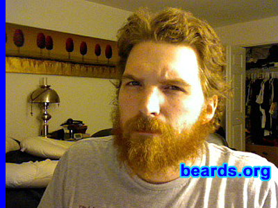 John M.
Bearded since: 2011. I am an experimental beard grower.

Comments:
I decided to start growing my beard because I just recently separated from the Air Force. In the military, facial hair is frowned upon and strict regulations are imposed to keep men from growing a beard. I made a promise to myself that when I got out of the military, I would grow the beard from day one. It's almost as if it's a symbol of my freedom and a reminder that I can grow my facial hair any d@mn way I please.

How do I feel about my beard? I love it! I've picked up the habit of stroking the beard when I'm engaged in stimulating conversation.  And it feels good to know that not that many of my friends are as beard-capable as I am. I often get compliments on it (along with some rude comments). But the best part is knowing at the end of the day I'm doing what I want with my facial hair. While I DO love the beard, it does have some downsides. I often wish that my hair wasn't so wiry. It's rather curly, which is a different look than what I'm really going for. We'll see how it looks as the years go by though.
Keywords: full_beard