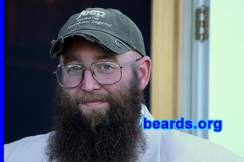 Matt "Boots" B.
Bearded since: 1997.  I am a dedicated, permanent beard grower.

Comments:
Started out between my junior and senior year in high school when we spent a week canoeing the Allagash. Got back, and noticed I had a pretty good crop of stubble going, and figured I'd let it go. I have a full beard in my senior pictures. Been going ever since. Only been completely clean shaven once since. Shaved it off one time for my mother for Christmas. She'd been after me to do it ever since I grew it. Immediately regretted it, told her to take lots of pictures, because it was NEVER happening again. Currently been really letting the beard go just to see what happens. It used to bug me when it would start getting some length and I'd have to trim it back, but this time it just kept getting longer and I kept not caring. This is almost a year of growth.

How do I feel about my beard? I kept my beard in college because I realized how many guys couldn't grow one, despite trying. Goatees were everywhere. Very few had beards. Many just lacked the ability to grow one in. My freshman roommate tried to cultivate one and just looked like had mange for two months. I grow my beard for all those that can't. It makes me look much older, which I've never had a problem with. With my beard, I look ten years older. Without it, I look twelve.  There's no happy medium. So I'll stick with the beard. I like it. Nobody really grows serious beards anymore. It's a shame.
Keywords: full_beard