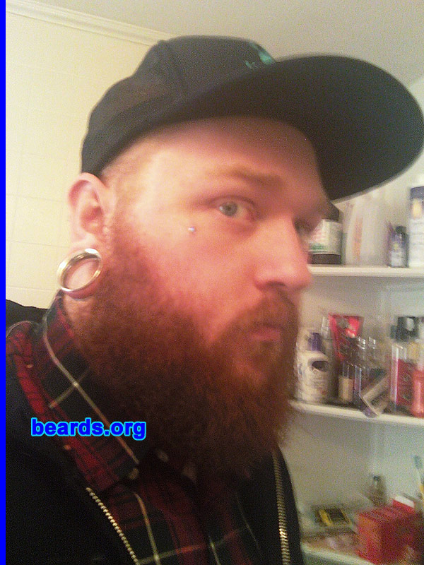 Jesse
Bearded since: 2003. I am a dedicated, permanent beard grower.

Comments:
When I was nine, I saw a 19-20 year-old man with a large full beard. Ever since then, I've wanted to be bearded. I've had facial hair since I was twelve, but I've had a goatee and/or full beard since I was about fourteen. I haven't seen my chin since.  Ha ha.

How do I feel about my beard? I feel as though it has a little bit of thickening up to do.  But I get compliments on it daily.   I also love that my beard is very, very red.
Keywords: full_beard