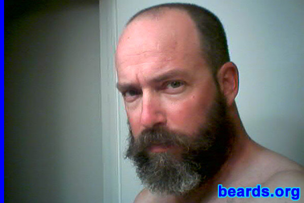 Martin Manning
Bearded since: 1995. I am a dedicated, permanent beard grower.

Comments:
When I was in high school, and college: and when I HAD hair, I looked a lot like David Cassidy, which was something I didn't like. But, since it was the 70s/80s I didn't think too much about it. I was in a play where I had to grow out my beard. I really liked NOT looking androgynous, and felt I was onto something cool. I've kept it since, and with the exception of trimming hack jobs, I've been trying to get it fuller since.

I like that it's curly, and over time its gotten much fuller. I do wish it was higher on my cheeks, and that my sideburns were thicker. 
Keywords: full_beard