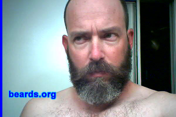 Martin Manning
Bearded since: 1995. I am a dedicated, permanent beard grower.

Comments:
When I was in high school, and college: and when I HAD hair, I looked a lot like David Cassidy, which was something I didn't like. But, since it was the 70s/80s I didn't think too much about it. I was in a play where I had to grow out my beard. I really liked NOT looking androgynous, and felt I was onto something cool. I've kept it since, and with the exception of trimming hack jobs, I've been trying to get it fuller since.

I like that it's curly, and over time its gotten much fuller. I do wish it was higher on my cheeks, and that my sideburns were thicker. 
Keywords: full_beard