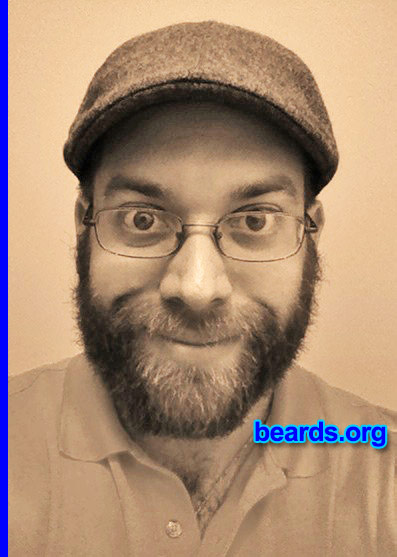 Christian R.
Bearded since: 2014. I am an experimental beard grower.

Comments:
Why did I grow my beard? Participated in NO SHAVE NOVEMBER and shaved December 1st. All the woman I work with said I was the only guy who looked good at the end of the month and were disappointed that I shaved. I decided to start growing again about a week later, as a first attempt to grow a beard. It is an experiment for now, since I have never been able to grow a beard before due to working in the security sector and in law enforcement where strict shaving policies where in place. My new job has none of that garbage in place!

How do I feel about my beard? So far I like it and get many compliments from males and females alike. I have found it is more fun to wash and comb than it is to shave.
Keywords: full_beard