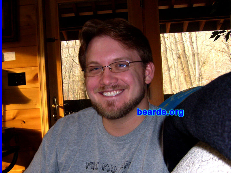 Atonn S.
Bearded since: 1995.  I am a dedicated, permanent beard grower.

Comments:
When I was in high school, I got tired of people pushing their fingers into my chin dimple.  So I grew a "Balbo" at age sixteen. In my early twenties, it turned into a chin strap plus mustache.  After I got married, since about age twenty-eight, I've moved to a short boxed beard beard.   Lately, I have been experimenting with letting it grow out into a full natural beard for periods of about three months... which is about when my wife starts making comments about not kissing me anymore.  So I groom it back to a short boxed beard.

How do I feel about my beard? I love my beard. I love the way it makes me feel. I've been told that it makes me look both "majestic" and "regal". Wearing different styles can almost feel like taking on different identities.  But no matter the style, it's always a good feeling to have a beard. In the last fifteen years, I've only shaved it completely off twice: once for a stage production, and once when I lost a bet.
Keywords: full_beard