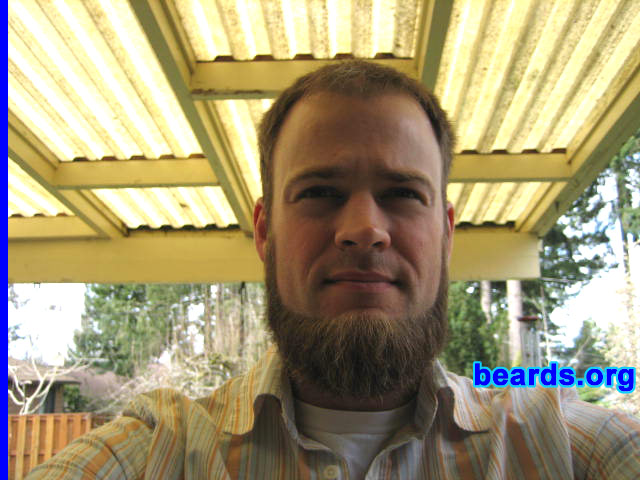 Ian May
Bearded since: 2005.  I am an experimental beard grower.

Comments:
I grew my beard because my wife used the last razor and I was too busy to get to the store for a couple of days.  Then the negative comments kicked in, which motivated me to grow it out a bit.  That was almost five months ago.

I really did not like it at first, especially before shaving the mustache off.  I felt like I was looking at someone else in the mirror, and it was uncomfortable feeling. Now I like it quite a bit and plan to keep it to the six month point at least. I think the style suits me well and enjoy fiddling with it while I work.
Keywords: chin_curtain
