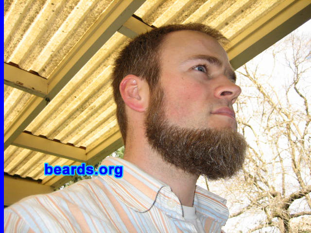 Ian May
Bearded since: 2005.  I am an experimental beard grower.

Comments:
I grew my beard because my wife used the last razor and I was too busy to get to the store for a couple of days.  Then the negative comments kicked in, which motivated me to grow it out a bit.  That was almost five months ago.

I really did not like it at first, especially before shaving the mustache off.  I felt like I was looking at someone else in the mirror, and it was uncomfortable feeling. Now I like it quite a bit and plan to keep it to the six month point at least. I think the style suits me well and enjoy fiddling with it while I work.

Keywords: chin_curtain