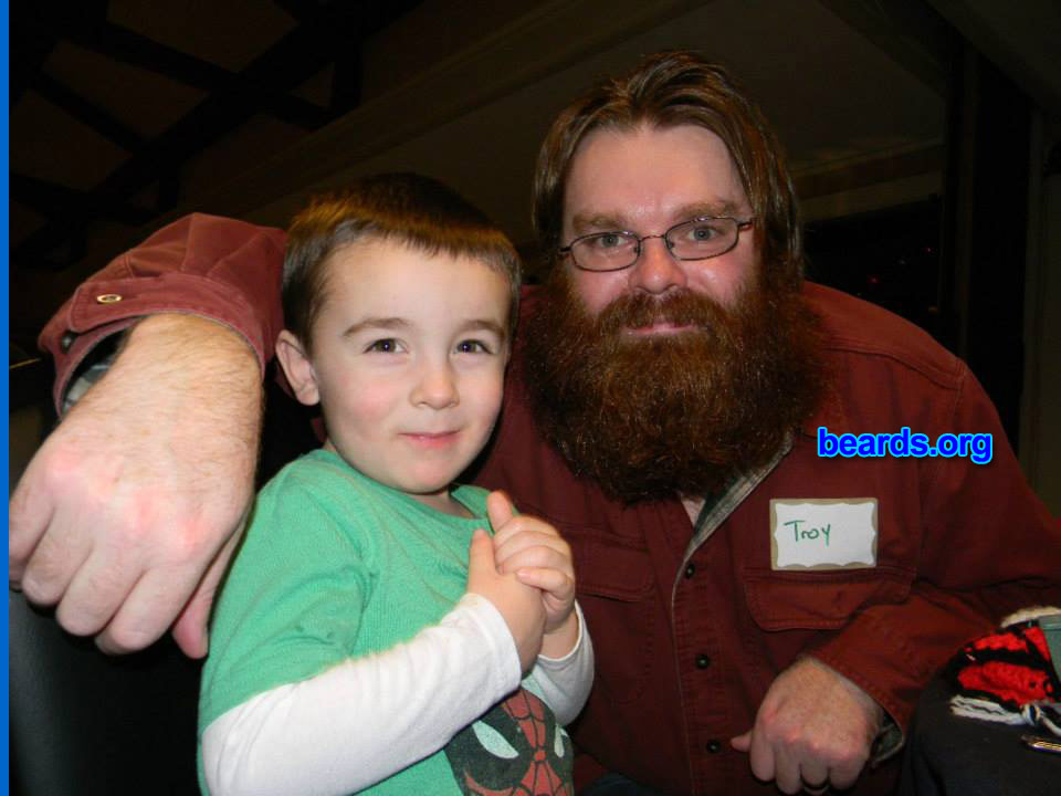 Troy
I am a dedicated, permanent beard grower.

Comments:
Why did I grow my beard? My beard grows me.

How do I feel about my beard? I'm happy with it. This picture with my son, Henry, was after the shave.
Keywords: full_beard