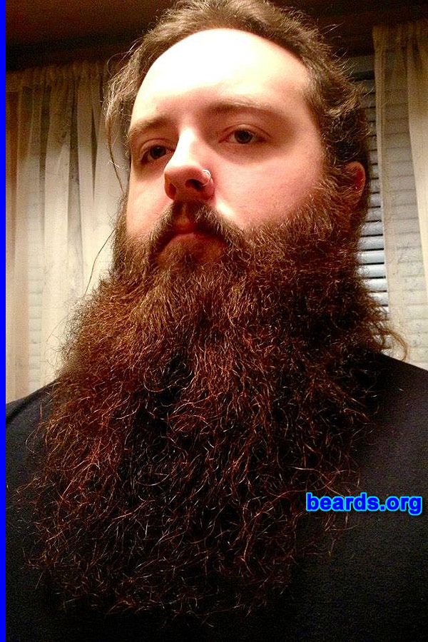 Bearded since: 2011. I am a dedicated, permanent beard grower.

Comments:
I first began growing facial hair at the age of fifteen. Though, of course it came in light at the time, I always had a great appreciation for facial hair; especially a thick full-beard. Throughout the years as my facial hair developed, I grew, maintained, and learned how to sculpt/trim many different styles, and also experimented with dyes/etc. as I front an established and decently well-known touring band. So my profession encouraged my experimentation with unique facial hair. After attempting a few full-beards through the years before I was manly enough to take a real one on, I ended up doing away with them. However, in late July of 2011 (at the age of twenty), I looked myself in the mirror and after seeing the thick whiskers of only a few days of no shaving- with no patches or light spots to be seen, I decided I was now man enough to commit myself to the journey of becoming a real beardsman. At that point, I began growing the thick, long, full-faced beard that I sport today...

How do I feel about my beard? I'm very proud of my beard and the journey it has taken me on throughout the past two years. In the area of the country that I live in; while there are many who admire a great beard, there aren't a lot of beardsmen, and there can definitely be some discouraging folks at times. However, my commitment to my beard is strong, and I surround myself in my personal life with other beardsmen/people who appreciate facial hair. As a matter of fact, my beard was crowned second place in the Erie Country Max and Erma's annual beard competition in November of 2012; covered by the local and regional news channels and papers. My band [url=http://www.sacred13.com/]Sacred 13[/url], who has toured the country alongside icons as big as Alice Cooper and Bad Company, is known for our unique style of "Beard Metal" as my cousin and bassist Gus Ward also has a thick, long, and glorious beard. Fans in the region have even began referring to our band as the "ZZ Top of Metal". I'm incredibly happy with the notoriety and positive vibes my beard has acquired over the past two years, and at the end of the day, public thoughts aside, I myself am proud to be a beardsman. Thank you for including me on your site with all the amazing beards featured here! Here's to keeping great facial hair alive and classy!
Keywords: full_beard