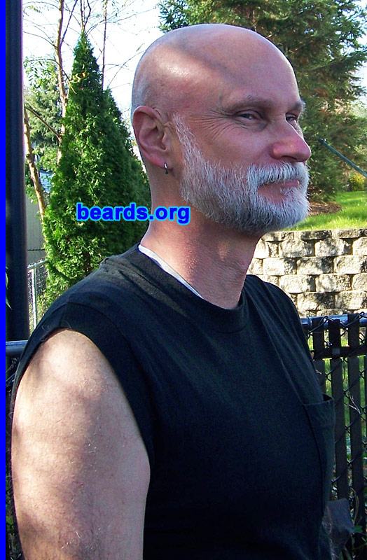 Joseph S.
Bearded since: 1977.  I am an occasional or seasonal beard grower.

Comments:
I grew my beard because I have always liked facial hair.  I started growing facial hair when I was about eighteen and then tried (and liked) a beard at the age of nineteen. Of course back then when I had hair, it was medium brown with a black beard. Today all that is left of color are the remnants of black shading on the lower part of the beard.

How do I feel about my beard? I love it.  It keeps me warm in the wintertime and looks awesome. Come early spring, I crop my beard to a wing-back.  In summer, I usually end up with a Fu Manchu mustache.
Keywords: full_beard