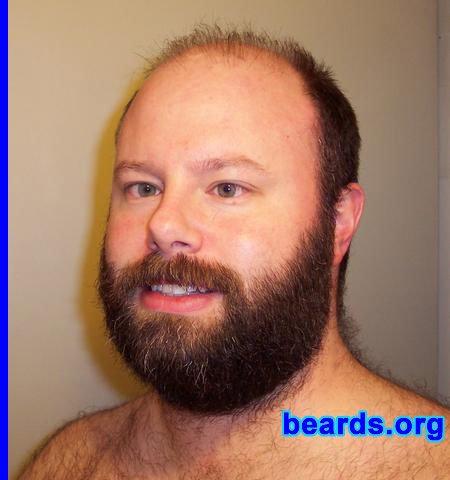 Spencer
Bearded since: 2000. I am a dedicated, permanent beard grower.

Comments:
I grew my beard because I've always liked the bearded look. I've had goatees in the past, but have kept a full beard for a while now. I recently decided to let it grow and get bushier.

My beard is thick and I'm hoping my fur collar will grow in a little more. I've always admired the "cover man" for this site, so I hope to do him justice with my tribute. 
Keywords: full_beard