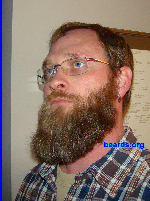 Gabriel
Bearded since: 1996 on and off. I am an occasional or seasonal beard grower.

Comments:
Why did I grow my beard? I am a man and I can.  It's my face. Why not?  I grew my beard primarily because I despise shaving. I've kept at least a Van Dyke for more than a decade, with the full beard making an appearance in colder months.

How do I feel about my beard?  I dig it. It's my "facial parka" for the winter. It has no equal in protecting the face during winter months.  It helps one when thinking (the stroking of that carpet upon my face).  So it is very helpful. I quite enjoy it.
Keywords: full_beard