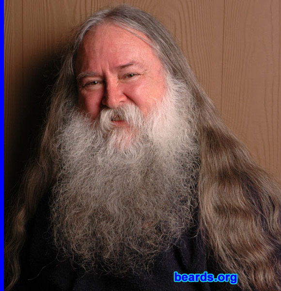 Gordon E. Peterson II
Bearded since: 1971.   I am a dedicated, permanent beard grower.

Comments:
I grew my beard, originally as a university student, because I felt it was just a stupid hassle and waste of time and money to shave all the time. Since then, I've come to appreciate it on many levels. It keeps your chin and cheeks warmer in winter and cooler in summer. It helps keep drops and drips off of your shirt or jacket. It gives a man a more distinctive look... people remember meeting me. This is the way God WANTED AND INTENDED for me to look... why should any man have a problem with that? It provides a nice filter to screen out folks that aren't worth wasting my time with. It helps avoid me (as also a long-haired man) from ever being mistaken as a woman.   I don't mind letting the world visibly and unambiguously see that I am a 'fully functional male'. :-) The fact that it's not a look which can be achieved in a short amount of time is evidence of a certain self-confidence and stability of self-image, which I think shows people that I'm likely to be predictable and dependable. It shows that I'm capable of setting my sights on a long-term goal and achieving it, without having changed my mind in the meanwhile. There are other reasons too, but that's good for a start. :-)

I love it. I love having it, I love the way I look with it, I feel it helps set me apart from "ordinary" folks. I believe that 'normal' implies a boring kind of mediocrity... it is not something one aspires to. I truly don't understand what possesses other men to feel compelled to take a sharp object every morning and to try their best to remove every visible trace of their being a fully-functional male from their face before leaving the house... or why a 'five-o'clock-shadow' should be something somehow embarassing. What is it about being a MAN that they don't like???
Keywords: full_beard