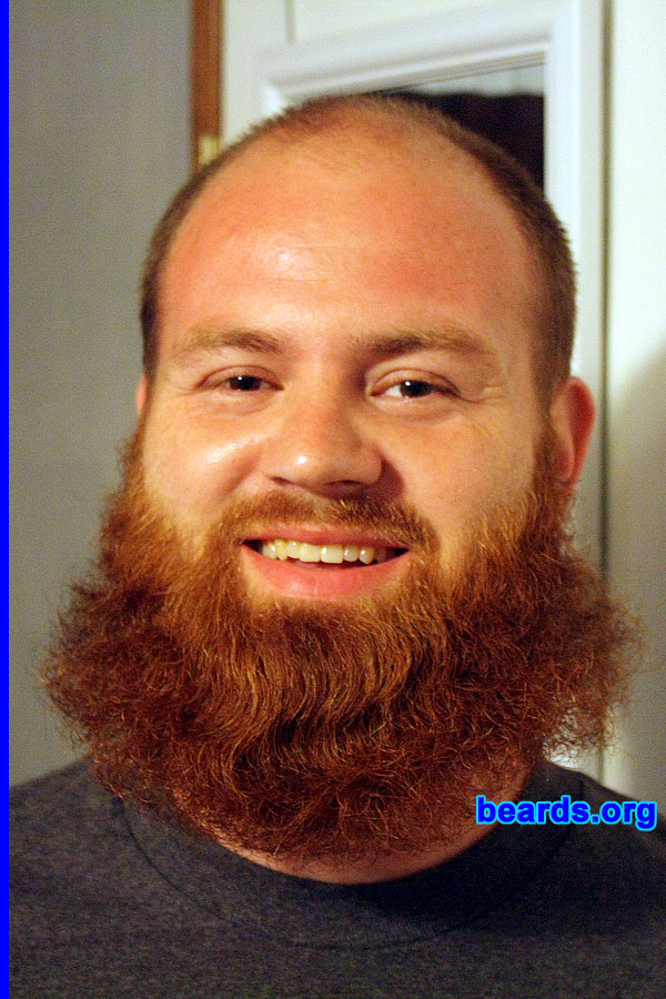 Will H.
Bearded since: 2011. I am a dedicated, permanent beard grower.

Comments:
I started out with a baby face, but as I got older and lost my hair I thought I would make up for it with a goatee. Last year my wife and I were joking around about me growing a full beard like my dad since I was on vacation. So about eight months ago I started and haven't stopped. We went through a few stages of long goatee, short full beard, etc. but people love the red and how big it is and we are always drawing attention, especially since we live in a small country town. It's always funny when people ask if I wash it and it's usually always the first thing someone asks about when they meet me. It's been an ongoing joke at my job and with family, but I am seeing just how long I can get it.

How do I feel about my beard? I love my beard full. At times it itches and drives me crazy, but overall I like having it. With age I am looking more and more like my dad, who also has a full beard, but only during certain months. I enjoy that it makes me stand out in a crowd and different than everyone else. 
Keywords: full_beard