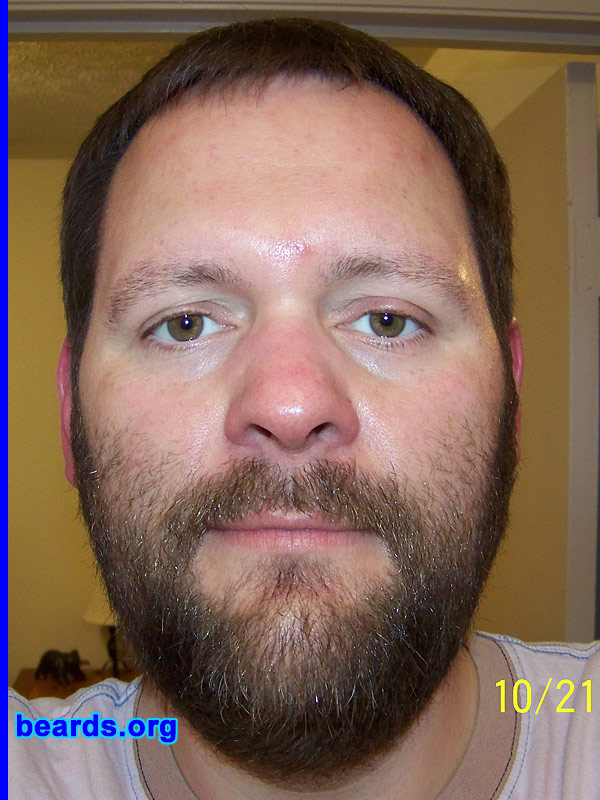 Curtis
Bearded since: 2008.  I am an experimental beard grower.

Comments:
I usually try to start a beard every couple of years but always "trimmed it to death" before I ever got very far. I started one this year and found your website, which encouraged me to stop trimming it. I am just seeing what kind of beard I can grow at this point. And it sorta hides the double chin. I never had a dad in the home to ask advice so I it was nice to find this site.

How do I feel about my beard?  This is at about eight weeks. I like the color and hair length so far. You can see where I trimmed the cheeks and neck for the first four weeks, until I found this site. I do have a major swirl pattern under my chin so I am not sure what to do about that. I am just letting it grow to see if it straightens out or if I will have to trim it to look decent. It seems to be curly as it grows, with random straight hairs that stick out. I never noticed how "un-perfect" beards could be. Mine definitely does not just lay flat. If I run a brush opposite of the growth pattern, it looks very bushy, but I do try to brush it several times a day.
Keywords: full_beard