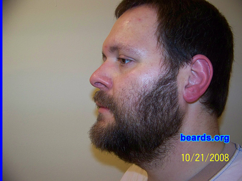 Curtis
Bearded since: 2008.  I am an experimental beard grower.

Comments:
I usually try to start a beard every couple of years but always "trimmed it to death" before I ever got very far. I started one this year and found your website, which encouraged me to stop trimming it. I am just seeing what kind of beard I can grow at this point. And it sorta hides the double chin. I never had a dad in the home to ask advice so I it was nice to find this site.

How do I feel about my beard?  This is at about eight weeks. I like the color and hair length so far. You can see where I trimmed the cheeks and neck for the first four weeks, until I found this site. I do have a major swirl pattern under my chin so I am not sure what to do about that. I am just letting it grow to see if it straightens out or if I will have to trim it to look decent. It seems to be curly as it grows, with random straight hairs that stick out. I never noticed how "un-perfect" beards could be. Mine definitely does not just lay flat. If I run a brush opposite of the growth pattern, it looks very bushy, but I do try to brush it several times a day.
Keywords: full_beard