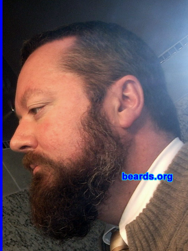 Ben
Bearded since: 1991.  I am a dedicated, permanent beard grower.

Comments:
I grew my beard because I always wanted to grow one, but was unable to until I got out of the Navy. I've kept it 99% of time since then (with occasional forays into goatee land). Current growth is unchecked since November 2009 (except for side trimming to blend for haircuts).

How do I feel about my beard?  I'm wavering at the "do I need to trim it back?" vs. "how far can I go?"  I'm in a white collar profession.  So I am starting to worry about looking "professional".
Keywords: full_beard
