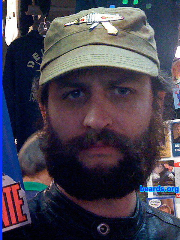 Django
Bearded since: on and off since puberty.  I am an experimental beard grower.

Comments:
I grew my beard because facial hair experimentation is one of my favorite ways to keep people guessing. Folks who only see me once a month, always marvel at how different I look at each encounter. These photos are not quite current. The beard part went away, and now I've got a Dali-worthy mustache only.

How do I feel about my beard?  I love my beard and mustache. In fact, the main reason I shaved my beard was so that I wouldn't keep finding bits of muffin in it. Nearly had a disaster one day, when I found a marble-sized crumb of a recently-eaten pastry hanging out in my facial hair scant minutes before an important business meeting. So it had to go.
Keywords: full_beard
