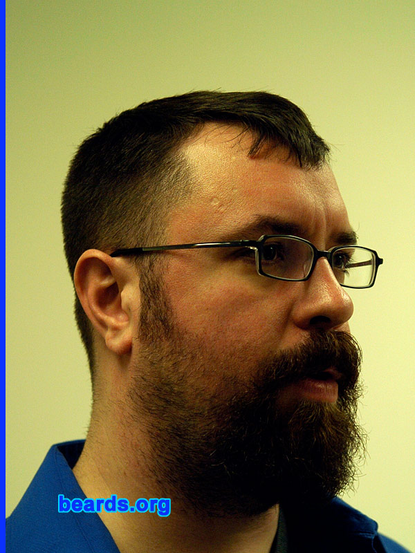Gryphon M.
Bearded since: 1995.  I am a dedicated, permanent beard grower.

Comments:
I grew my beard because I admire beards on men and grew up with bearded men. Once I had a job where my employer didn't complain about me being bearded, I stopped shaving.

How do I feel about my beard? It's full and thick, multi-colored. I just want to grow it longer without it getting all frazzled. I've changed it a lot over the years, but I keep coming back to the full beard, often with the cheeks a bit shorter than the chin.
Keywords: full_beard