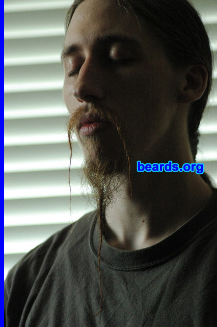 Jacob B.
Bearded since: 2006.  I am a dedicated, permanent beard grower.

Comments:
Why did I grow my beard? I had wanted to for quite some time, seeing my father with a full beard my entire childhood, but I had very sparse and slow growing facial hair. One summer I finally felt like I had enough coverage, at least on my lip and chin, to start growing out.

As a secondary sexual characteristic, beards represent manhood. Having facial hair certainly helped to lessen the previously numerous times I would be confused with a woman for my long hair (and short stature of 5'4").

How do I feel about my beard? I feel my beard is truly a part of me. I've been told that my beard seems tailored for my face and personality in a way people don't normally see. I think it has to do with the fact that for the most part I don't do anything to maintain the "style" I carry other than shaving off the floating mutton chops on my cheeks and twisting the ends of my "fu" to keep individual hairs out of my mouth while eating and twisting the end of my "mandarin" goatee to keep the longer hairs from getting pulled out.

How do I feel about my beard?  I love it!
Keywords: goatee_mustache