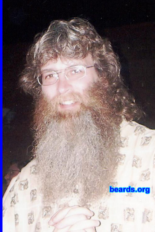 Tom S.
Bearded since: 1990.  I am a dedicated, permanent beard grower.

Comments:
I had a beard on and off for years...hated shaving.  Then I stopped shaving altogether on my wedding day, May 5, 1990. Beard has been growing ever since.

How do I feel about my beard?  It is a part of who I am and my identity. BUT everyone has been asking me for years what it would take me to shave my beard and cut off my mullet. I am doing just this on February 19, 2010 in public at our local high school varsity basketball game to try to raise money and show support for the families of four teens who were involved in a serious car accident recently. Three of the teens sadly died. Shaving my beard off is going to make me feel naked...  But I am doing this for a good cause.
Keywords: full_beard