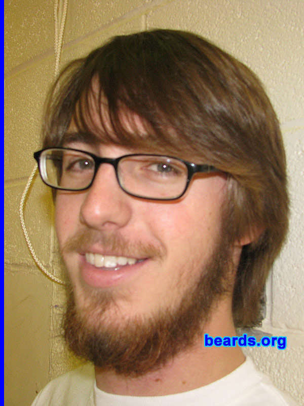 Nate
Bearded since: 2007.  I am an experimental beard grower.

Comments:
There's a funny story behind this actually. I saw an article about a man who grew out his beard for a whole year trying to live out the Old Testament Laws. (This was just one of the many things he did for this.)  But because of his picture, I was inspired to grow out my beard for a whole year without trimming the edges of my beard. (My friend also upped the ante by betting me I couldn't do it.) Due to complications with my work, I will only be able to grow it out for a little over six months. I'm currently venturing into month five and it has been quite a trip. I have not trimmed my beard at all since November of 2007 and I have occasionally trimmed my mustache. I'm only nineteen, so this is the longest I've ever grown my beard.

How do I feel about my beard?  I like my beard a lot. Although it's beginning to get a little out of a control. I couldn't be happier with this experience. I am a little ready to shave it, but only because I'd like to shape it, seeing as part of the deal is not to trim it at all.
Keywords: full_beard