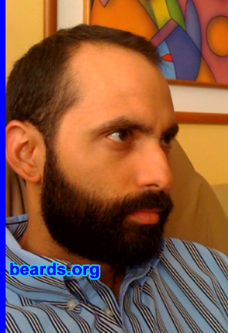 Giovanni P.
Bearded since:2010. I am an experimental beard grower.

Comments:
I always wanted to grow a beard, but I never passed the ten-day mark before. My idea was to make a video daily to see the difference. But after a few days, only the photos remained. This time, I passed the ten-day mark, but there was not a single photo of my beard until that day. After that, I took pictures every ten days. Right now I am at thirty-nine days without shaving. Only the neck line was done at day nineteen because my vacation ended.

Thanks to my vacation and the encouragement of my girlfriend, my beard is still growing and I am living the experience I always wanted: to be a bearded man.

This pic is from day 60.

How do I feel about my beard? I simply love it. All I can say is that it is a shame that I never tried before. It feels so good to go to work or to hang around looking like this. It's beautiful to watch it grow and to see your cheeks get darker everyday.

My girlfriend loves it. I get a lot of positive responses to my beard and my beard style. My choice was the full beard because that's the look I always wanted. Women look at me in a different way.
Keywords: full_beard