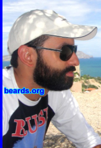 Giovanni P.
Bearded since:2010. I am an experimental beard grower.

Comments:
I always wanted to grow a beard, but I never passed the ten-day mark before. My idea was to make a video daily to see the difference. But after a few days, only the photos remained. This time, I passed the ten-day mark, but there was not a single photo of my beard until that day. After that, I took pictures every ten days. Right now I am at thirty-nine days without shaving. Only the neck line was done at day nineteen because my vacation ended.

Thanks to my vacation and the encouragement of my girlfriend, my beard is still growing and I am living the experience I always wanted: to be a bearded man.

How do I feel about my beard? I simply love it. All I can say is that it is a shame that I never tried before. It feels so good to go to work or to hang around looking like this. It's beautiful to watch it grow and to see your cheeks get darker everyday.

My girlfriend loves it. I get a lot of positive responses to my beard and my beard style. My choice was the full beard because that's the look I always wanted. Women look at me in a different way. 
Keywords: full_beard